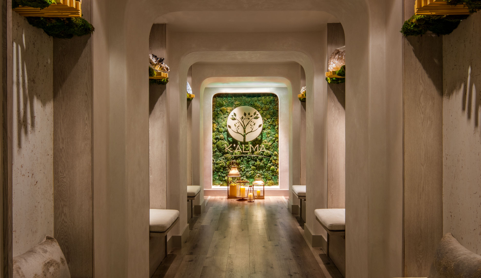 A hallway with benches and a large wall clock.